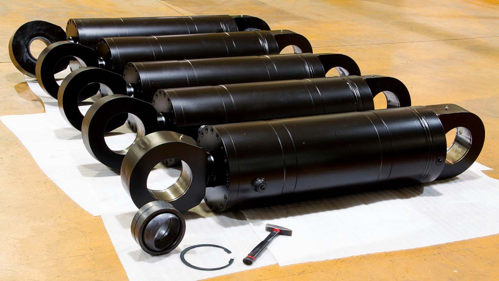 Using a tandem or dual piston cylinder